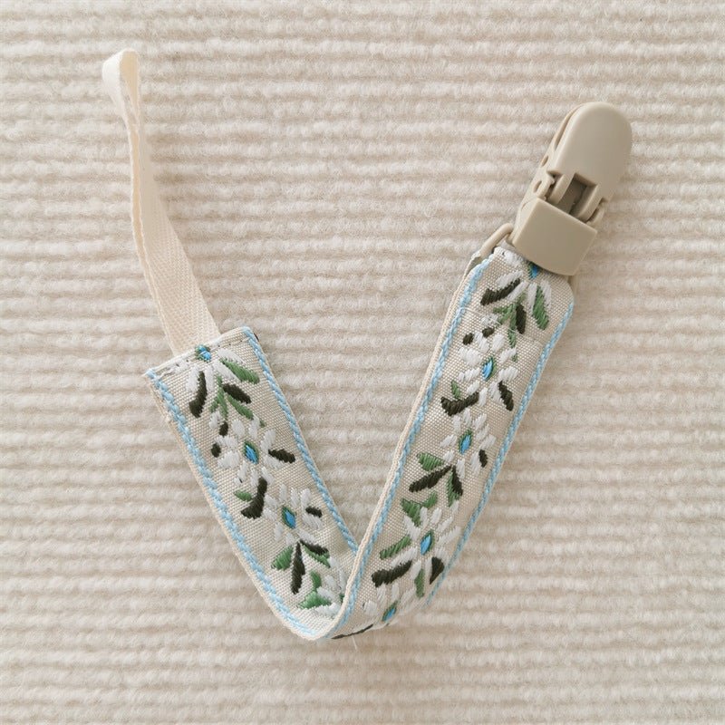 attache tetine feuille verte