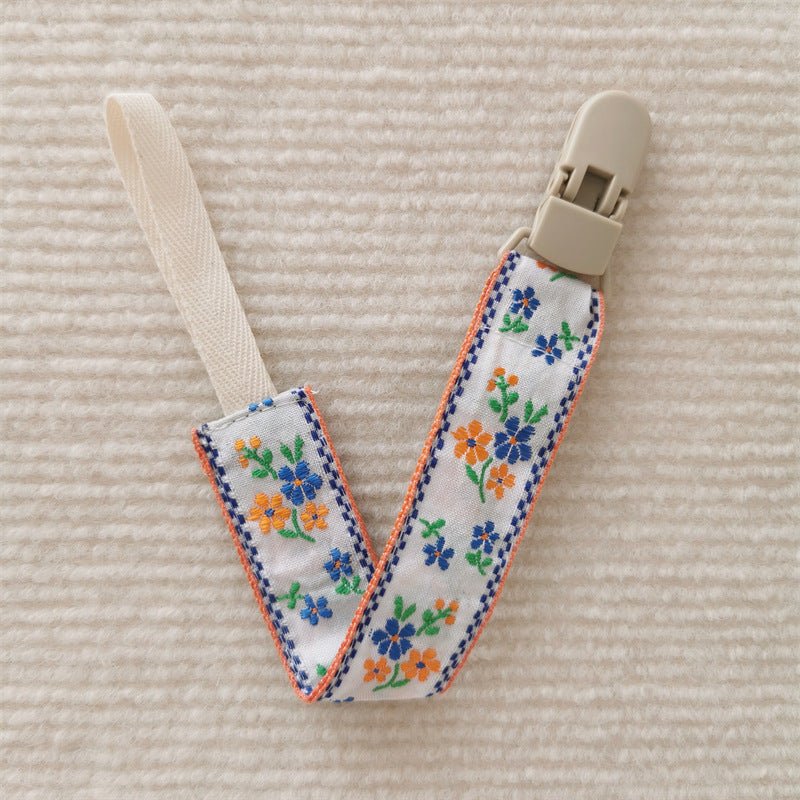 attache tetine orange bleu